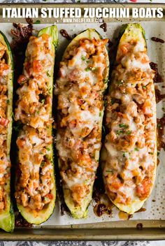 four stuffed zucchini boats on a baking sheet with the title above it that reads italian stuffed zucchini boats