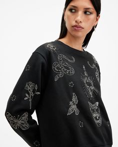 Lounge about in the Pippa Sweatshirt. It's crafted from a soft cotton-blend fabric to an easy silhouette. It's got statement AllSaints embellishments all over. Pair it with jeans or wide-leg pants for a day-to-day look that stands out.  This sweatshirt is designed to a relaxed fit Pullover Crew neck Long sleeves Ribbed trims Embellished artwork Sweat Noir, Sweater Season, Sweat Top, Jersey Sweatshirt, Workout Sweatshirt, Guest Outfit, Fashion Help, All Saints, Black Sweaters