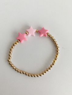 Pink and gold, stretchable, one piece Adjustable Gold Star Charm Bracelet, Adjustable Star-shaped Stretch Bracelet Gift, Adjustable Star-shaped Stretch Bracelet As A Gift, Adjustable Star-shaped Party Bracelets, Adjustable Gold Star Bracelet, Star Bracelet, Gold Gold, Gold Stars, Arm Band