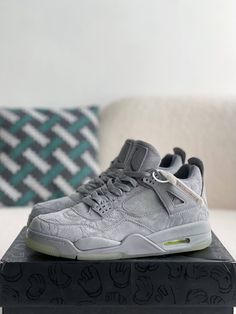 Channel the iconic KAWS x Air Jordan 4 with these inspired sneakers. They feature the same cool grey suede upper, complete with the distinctive "XX" pattern. Meticulous attention to detail ensures a look and feel that rivals the original, at a fraction of the price. Experience the legendary style and comfort of the coveted Kaws Jordan 4. Gray Air Jordan 4 Streetwear Sneakers, Gray Air Jordan 4 For Streetwear, Gray Air Jordan 4 Streetwear, Gray Air Jordan 4 Sporty Streetwear, Gray Air Jordan 4 Casual Streetwear, Casual Gray Air Jordan 4 For Streetwear, Gray Low-top Air Jordan 4 For Streetwear, Sporty Gray High-top Air Jordan 4, Casual Gray High-top Air Jordan 4