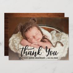 a baby sleeping in a basket with the words welcome