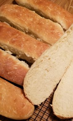 several loaves of bread on a cooling rack