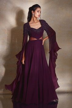 Burgundy gown with placed bead sequin embellished gradient patterns, sheer side panels and ruffle cape sleeves. - Aza Fashions Cape Dress Indian, Wedding Dress Shirt, Burgundy Gown, Beads Tassels, Georgette Gown, Long Frock Designs, Long Sleeve Ruffle Dress, Long Frocks, Embellished Gown