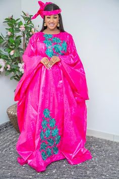 Description: This magnificent custom African dress is perfect for any occasion you want to look your best. It includes 3 pieces (Full dress, wrap-around or Skirt and head-tie).   Important Note: For broderie mix with bazin and garniture mix clothes only: Depending on the availability of the( fabric) / Garnitures (TRIMS) may be different than the one in the pictured. However, the dress will be sewn exactly in the style and colors shown. You can always request to see the fabrics or trims before we start by sending us a message along with your order. PROCESSING: We usually take 6- 8 BUSINESS DAYS to make the dress. SHIPPING: We use DHL shipping with tracking and text update. (3 to 5 days) SIZING: What we need from you We have a sizing Chart in the images. Scroll to the right. (Providing your Festive Pink Satin Dress, Pink Long Sleeve Dress For Formal Events, Fitted Pink Kaftan For Party, Fitted Pink Kaftan, Elegant Pink Maxi Dress For Festive Occasion, Pink Long Sleeve Kaftan For Evening, Gold African Dress, Grand Dakar, African Tops