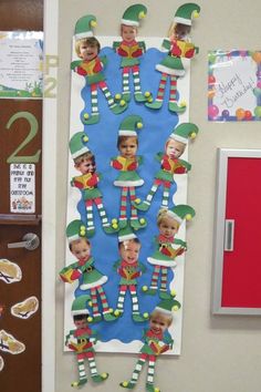 a bulletin board with pictures of elfs on it