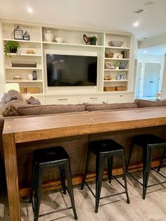 Bar Table And Chairs Behind Couch, Living Room Bar Seating, Counter Height Sofa Table With Stools, Game Room Living Room Ideas, Bar Seating Behind Couch, Bar In Living Room Ideas, Basement Bedroom Decor, Bar Behind Couch