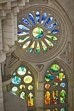 the inside of a church with stained glass windows