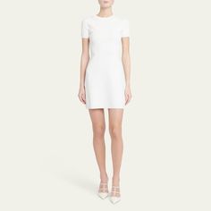 Valentino Garavani knit mini dress features a chain detailing at the neckline  Round neckline Short sleeves Hem falls above the knee A-line silhouette Back zip closure Viscose/polyester Made in Italy Luxurious Cream A-line Mini Dress, Chic Off-white A-line Mini Dress, Valentino White Dress, Valentino Dress Casual, Valentino Short Dress, Wardrobe Sale, Travel Size Perfume, Evening Flats, Cocktail Jacket