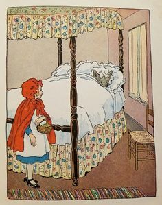 the little red riding hood is looking at the bed