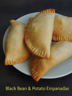 three black bean and potato empanadas on a white plate with text overlay