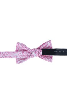 Fine silk further elevates a bow tie made effortless in an adjustable, pre-tied design. Pre-tied; adjustable 100% silk Dry clean Imported Pink Elegant Bow Tie With Decorative Bow, Elegant Pink Floral Print Tie, Pink Floral Bow Tie, Pink Luxury Silk Scarf, Adjustable Pink Bow Tie, Silk Bow Ties, Silk Bow, Pink Paisley, Bow Tie