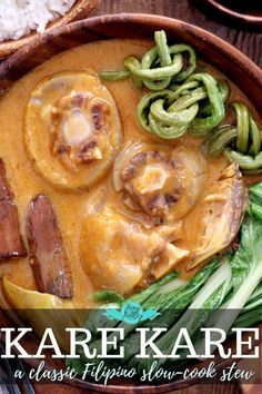 a bowl filled with meat and vegetables next to rice