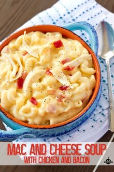 macaroni and cheese soup with chicken and bacon in a blue bowl on a napkin