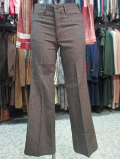 "Original 60s deadstock flared pants. NOS 60s trousers. Mods style. Made in Italy. They feature a jean model, such as the brown woollen cloth fabric whose weft threads are placed diagonally (see pic.9). Low waist with belt loops and besom pockets (pics 1-3). No back pockets (pic.5). Front zipper and button. Mint conditions. They fit size S, about 28 US Measurements: (lay flat and double waist, hips and thigh)) pls. consider the rise in order to calculate the waistline Waist 28.3\" rise 9.05\" hi Brown Flare Work Pants, Retro Brown Straight Leg Bottoms, Vintage Flare Pants For Fall, Retro Fitted Bottoms For Winter, Retro Wide Leg Pants For Work In Fall, Retro Flare Pants For Fall, Retro Brown Bottoms For Workwear, Retro Wide Leg Pants For Fall, Retro Fitted Winter Bottoms