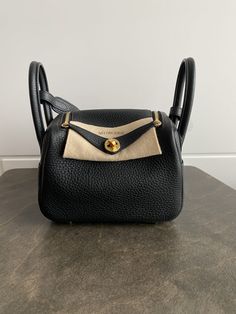 Hermès Mini Lindy Black Clemence With Gold Hardware Mini Lindy, Hermes Lindy, Hermes Bags, The Bag, Black Bag, Gold Leather, Full Set, Gold Hardware, Top Handle Bag