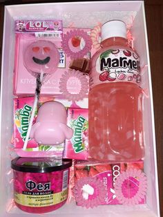 the contents of a pink box are neatly organized