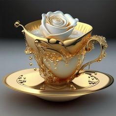 a white rose in a golden teacup on a saucer with gold trimmings