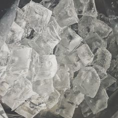 some ice cubes are sitting in a bucket