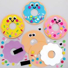 doughnuts are decorated with different shapes and colors to look like donut faces