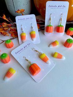 the earrings are made out of candy corn and carrots