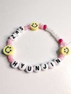 White Plastic Bracelets With Letter Beads, White Novelty Stretch Bracelet For Friendship, Handmade White Friendship Bracelets Kpop Style, Handmade White Plastic Beaded Bracelets, Kpop Style Friendship Bracelets With Round Beads, White Friendship Wristband, Adjustable Kpop Style Friendship Bracelets With Letter Beads, White Handmade Novelty Wristband, White Plastic Beaded Bracelets For Friendship