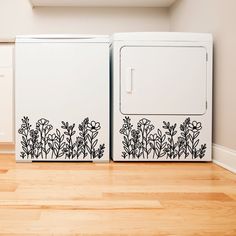 two white washers sitting next to each other on top of a hard wood floor