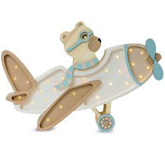 a wooden toy airplane with lights on it's wings and a teddy bear in the front