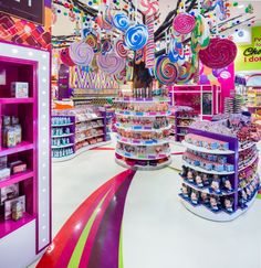 the inside of a candy store filled with lots of candies and lollipops