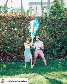 couple popping cannon with blue powder