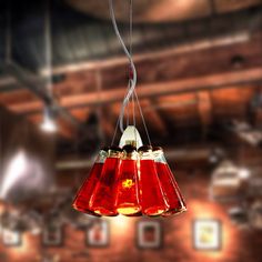 two red lamps hanging from a ceiling in a room