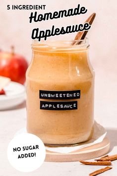 an apple cider with cinnamon sticks in it and the words, 5 ingredient homemade applesauce