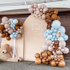 balloons are arranged in the shape of a bear and balloon arch for a baby shower