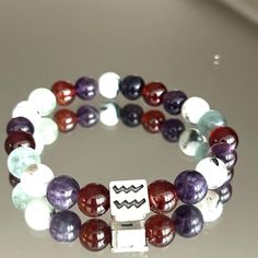 Pisces bracelet is a best unforgettable birthday gift. Beaded Pisces  Bracelet is for men and women. You can wear this handmade bracelet every day. It includes Amethyst, Lapis Lazulli, Carnelian and Fluorite Crystals. Pisces  Gift, Pisces  Zodiac Crystal Bracelet, Birthstones Crystal Jewellery Gift, Crystal Gifts, Pisces  Gifts Each bracelet comes in a gift bag  **Packaging: Each item is packaged in my branded packaging, so your order is ready to be gifted. Carefully chosen crystal combinations Symbolic Gemstone Bracelet As Gift, Spiritual Zodiac Sign Bracelet Gift, Crystals Aquarius, Aquarius Bracelet, Gift Bag Packaging, Crystal Combinations, Aquarius Gifts, Fluorite Crystals, Branded Packaging