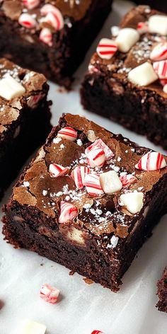 several brownies with candy canes and white chocolate chips