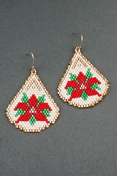 two pairs of beaded earrings with poinsettis on them