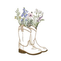 a pair of boots with flowers in them on a white background, embroidered onto the boot