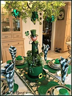 a st patrick's day table setting with green plates and napkins