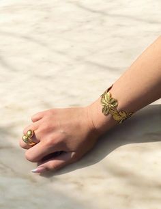 Introducing our Flower Gold Cuff Bracelet, a beautiful piece to add to your summer wardrobe. Pair with a sundress, a bikini, or your everyday wear for an elevated look.  Adjustable to your wrist size.  Materials: 18K GOLD PLATED STAINLESS STEEL. Waterproof. Tarnish Free. Hypoallergenic.  Our stainless steel jewelry is made with a thick layer of 18k gold on a stainless steel core. Our pieces are crafted using the PVD plating process, ensuring vibrant colors and unmatched durability. Waterproof an Bohemian Spring Bracelet, Gold Bracelet Jewelry For Spring, Gold Spring Bracelet, Spring Gold Bracelet Jewelry, Bohemian Cuff Bracelets For Spring, Spring Bohemian Cuff Bracelet For Gift, Spring Bohemian Cuff Bracelet As Gift, Gold Cuff Bracelet For Summer, Adjustable Bangle Jewelry For Summer