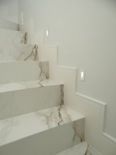 some white marble steps in a room