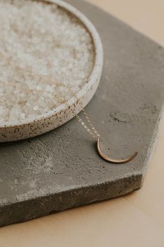 You asked, we listened! Our Mini Moon pendant necklace is for all our minimalist lunar lovers. Smaller in size, but still big in impact! 1.25" crescent moon is hand-forged and hammered for texture. Pendant is attached to an 18" delicate cable chain. Available in 14kt Gold Fill + Sterling Silver. Want a larger pendant? Shop our 2" New Moon Pendant. Jess styles our Mini Moon Pendant with our TINY Freshwater Pearl Necklace and Solitaire Necklace. Handmade in Eau Claire, WI. Our jewelry is handmade Copper Uses, Everyday Wear Jewelry, Solitaire Necklace, Mini Moon, Moon Pendant Necklace, Black Sapphire, Solitaire Necklaces, Freshwater Pearl Necklaces, Moon Pendant