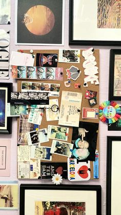 a bulletin board covered in pictures and magnets on it's side with other items