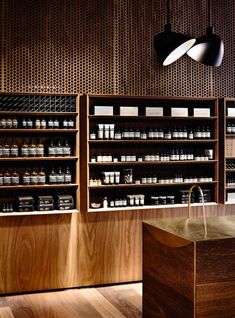 a store with wooden shelves filled with bottles