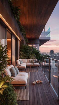 a balcony with couches and plants on it