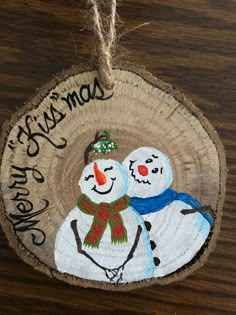 an ornament with two snowmen on it