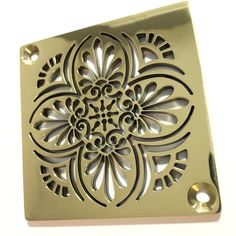 an ornate design is shown on the side of a square metal door handle, with holes in it