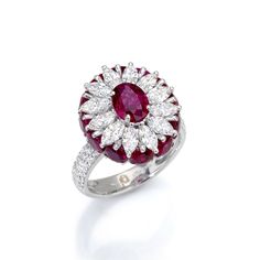 18K White Gold Ruby Diamond Ring Cluster of diamonds ring with ruby on the center Reference: 2B828R RUB=4.00 dia=2.22 Luxury Ruby Cluster Ring With Center Stone, Luxury Red Cluster Diamond Ring, Luxury Gia Certified Ruby Ring, Luxury Cluster Ruby Ring With Center Stone, Luxury Ruby Cluster Ring With Diamonds, Luxury Ruby Cluster Ring, Luxury Cluster Ruby Ring With Diamonds, Red Cluster Diamond Ring With Brilliant Cut, Cluster Ruby Ring With Diamonds