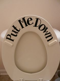 a white toilet with the words put me down on it's seat and lid