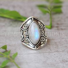 Indulge in timeless elegance with our handmade Rainbow Moonstone Ring for women, crafted meticulously in lustrous sterling silver. This enchanting piece features a high-quality, ethereal Rainbow Moonstone that captures the essence of a colorful, iridescent rainbow within its depths. The exquisite craftsmanship and delicate design make it a perfect accessory for any occasion, adding a touch of sophistication and mystique to your ensemble. Elevate your style with this stunning and unique creation. Elegant Handmade Moonstone Stackable Rings, Marquise White Sterling Silver Ring, Handmade Elegant Moonstone Stackable Rings, Marquise Sterling Silver Ring In White, Elegant Handmade Stackable Moonstone Rings, Unique Silver Marquise Cut Rings, Elegant Sterling Silver Moonstone Ring With Stone Setting, Elegant Handmade Sterling Silver Topaz Ring, Handmade Elegant Sterling Silver Topaz Ring