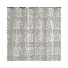 a white shower curtain with lace on it