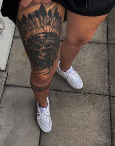 a person with a tattoo on their leg